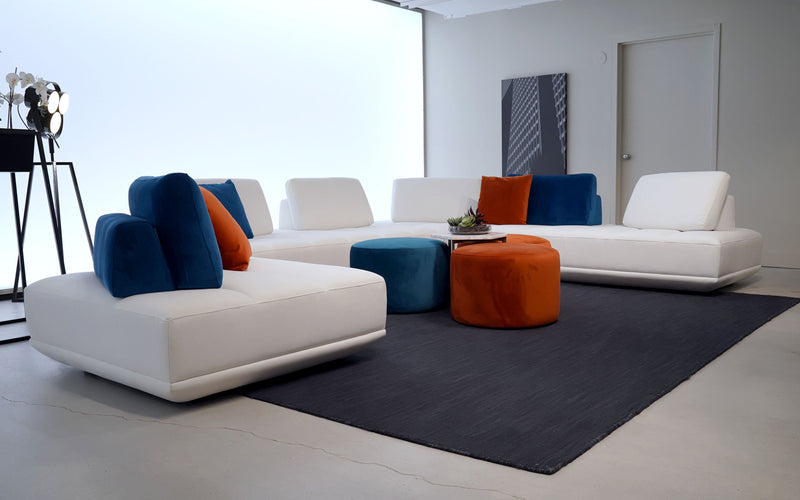 This custom sectional makes you feel as though you are sitting on clouds. The modular sectional couch also features adjustable and movable backrests. 