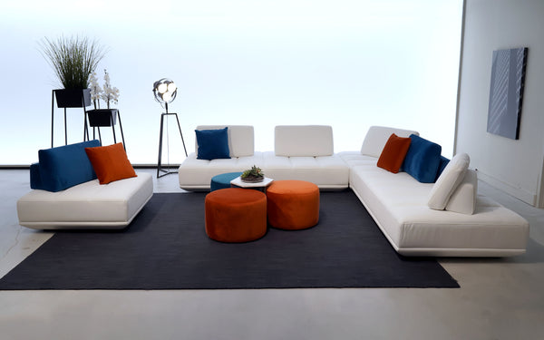 Modern Motion modular sectional with customized design. This modern living room furniture features a modular sectional that is easy to configure. It is perfect for when you want to relax in comfort with friends and family. This moveable sectional features oversized cushion sofas for roomy lounging and modular ottomans.  